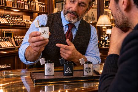 Elegant promotional lighters displayed in a tobacconist shop